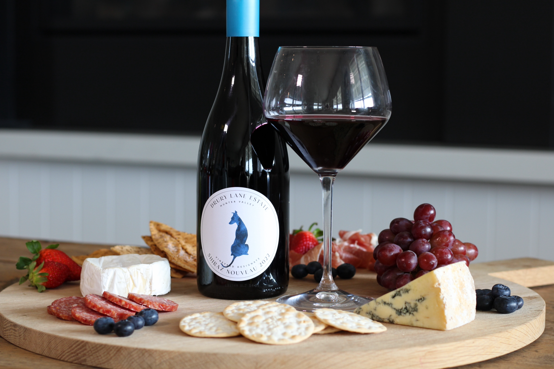 A bottle of  Drury Lane Estate Shiraz with cheese plate 